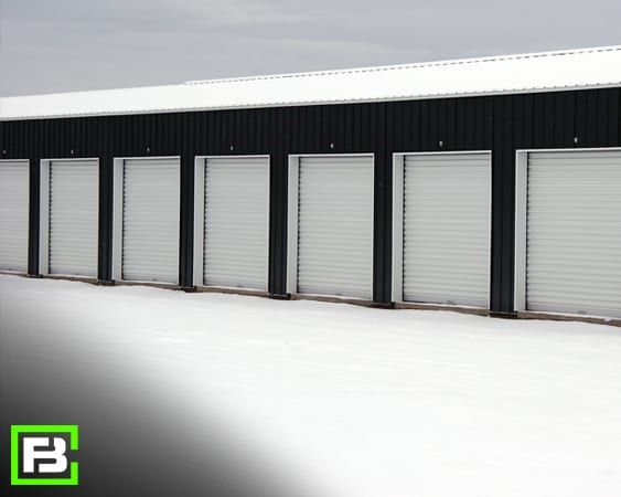 row of storage units in snow